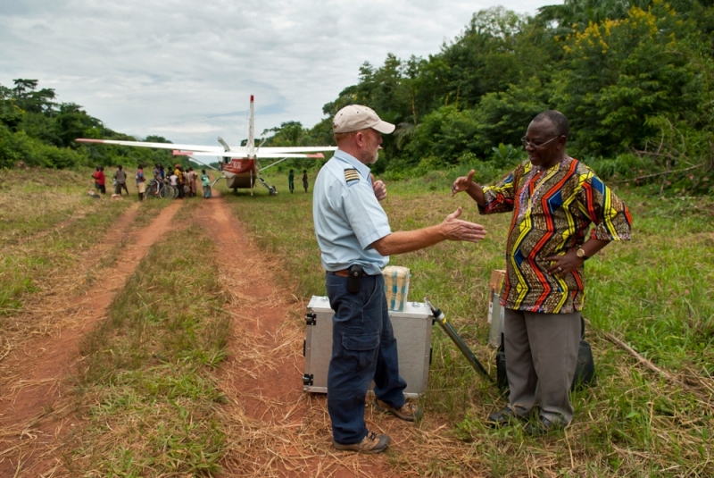 Jon says goodbye to an eye doctor he has dropped off on a remote airstrip in the Ituri Forest of DR Congo.