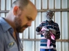 MAF Pilot Jason Job weighs passengers before boarding. Robert Yunupingu hold his 3-week old grandchild Winnifred. The programme in Arnhem Land is presently MAF’s biggest.