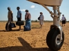 Passengers board at Kaabong Airstrip in Northern Uganda while Karamojong boys watch.