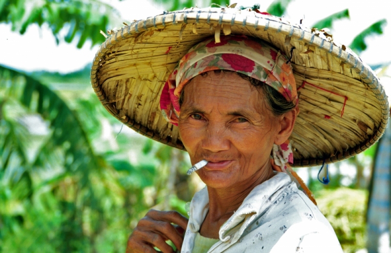 Filipino woman working in the rice fields.